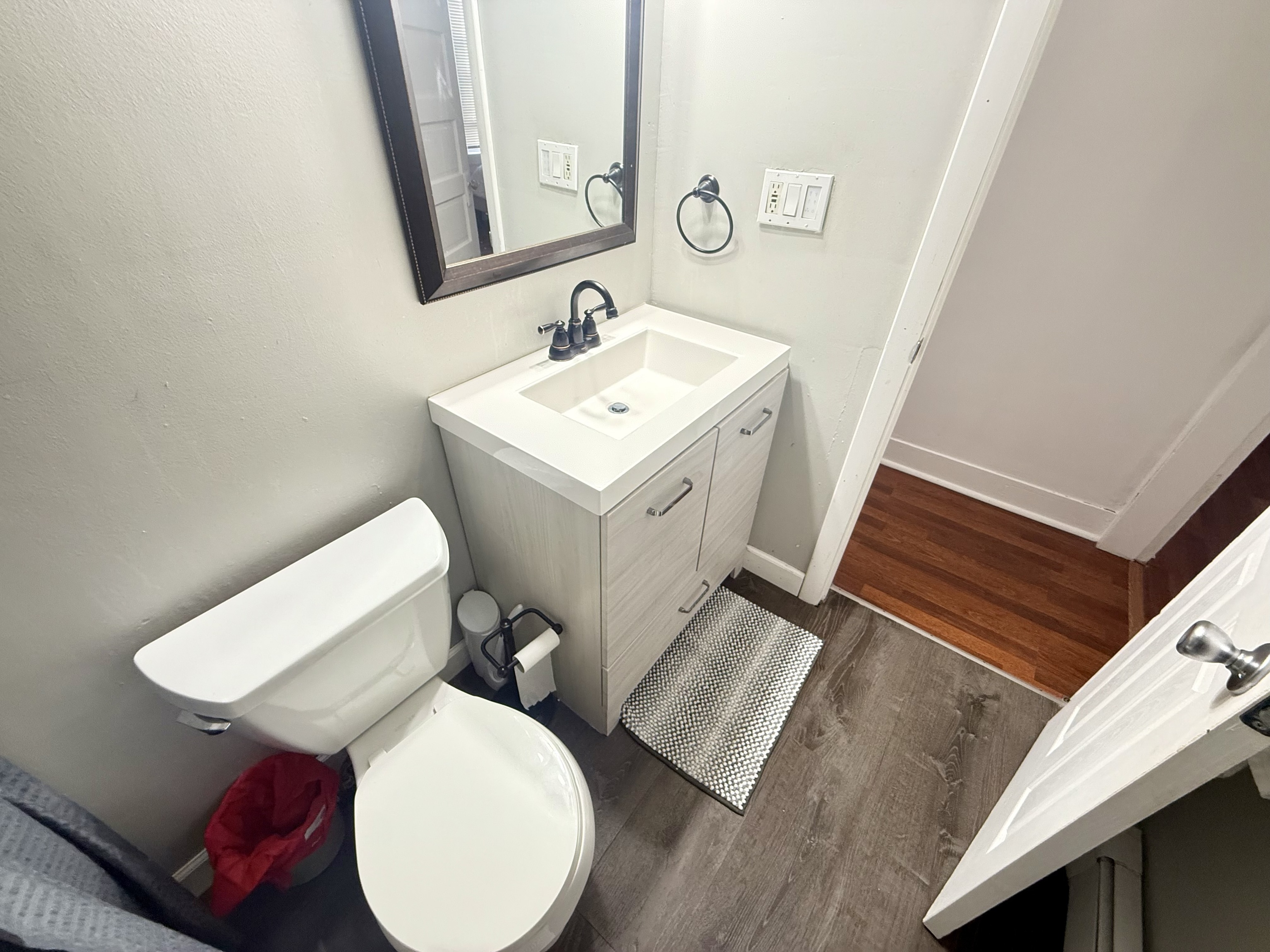 419 Huntington Road Stratford, CT 06614 - Photo 26 of 40 a bathroom with a toilet sink and mirror
