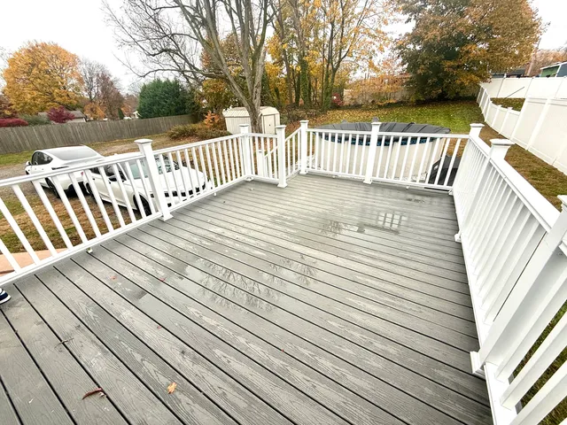 a view of deck and deck with wooden floor and fence