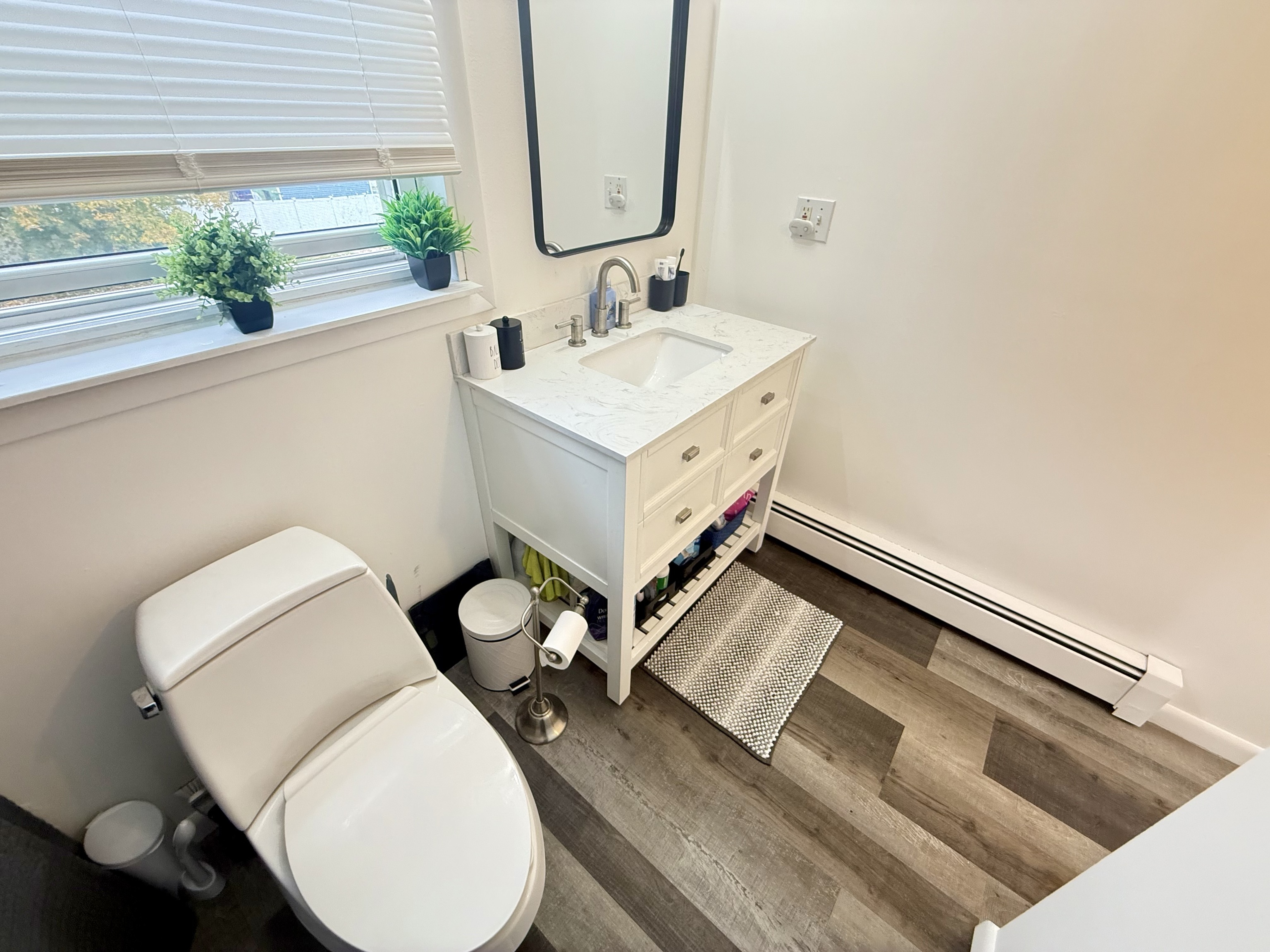 419 Huntington Road Stratford, CT 06614 - Photo 33 of 40 a bathroom with a toilet sink and mirror
