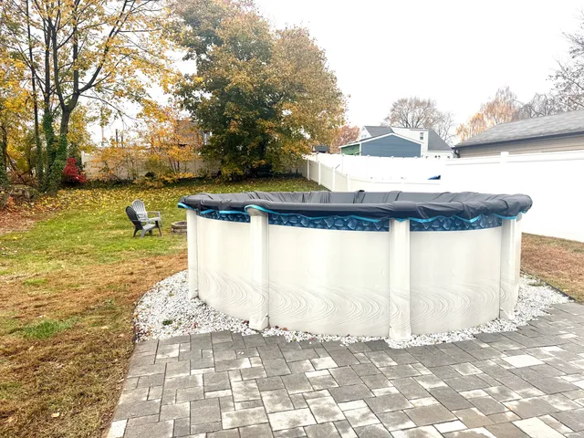 a view of a water fountain in the backyard of a house