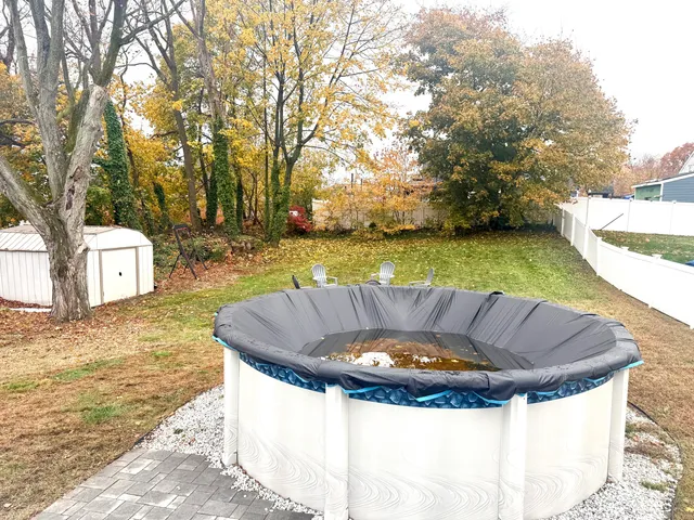 a view of a swimming pool with a patio