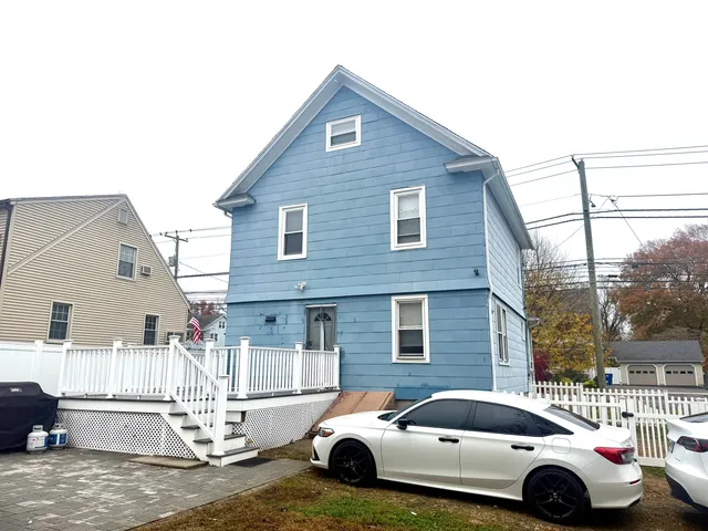 a front view of a house with parking space