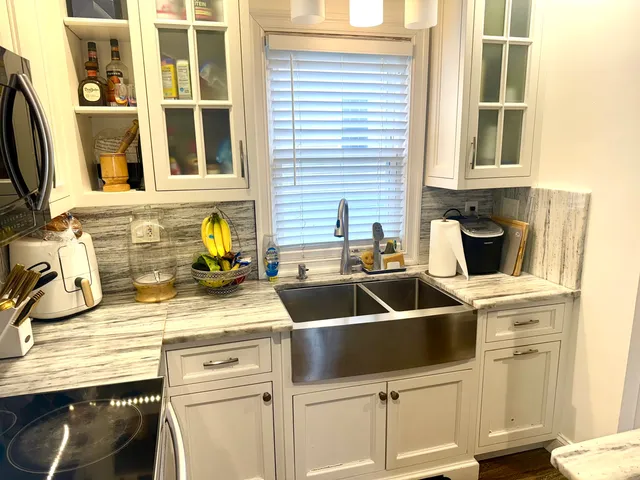 a kitchen with a sink and cabinets