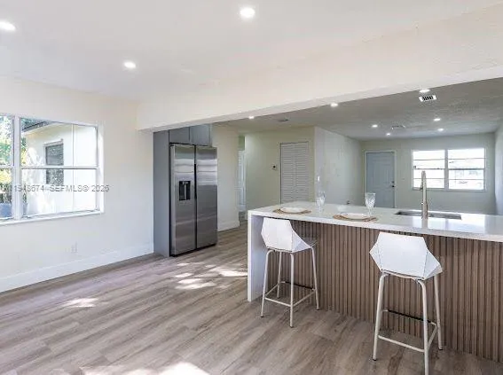 a kitchen with a table and chairs in it
