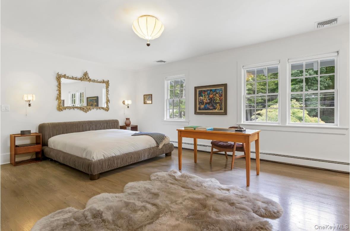 24 Acoma Road Tuxedo Park, NY 10987 - Photo 15 of 44 a bedroom with a bed and a large window