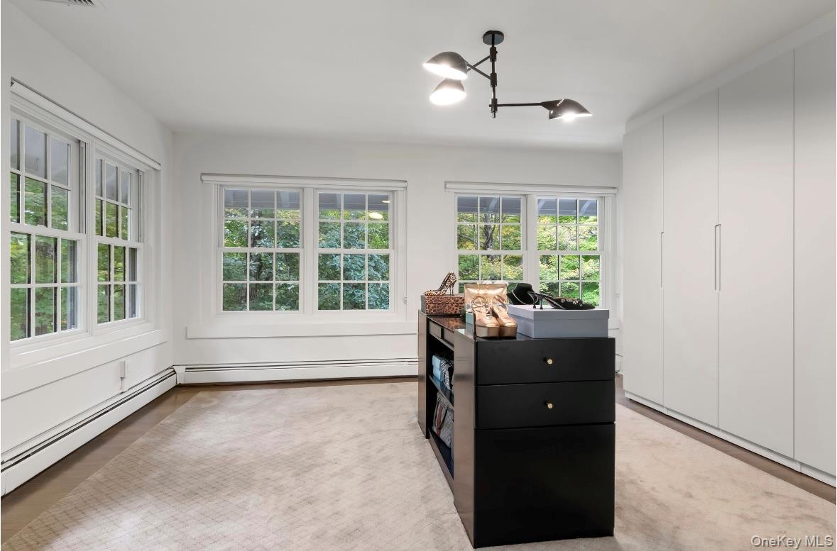 24 Acoma Road Tuxedo Park, NY 10987 - Photo 18 of 44 a living room with furniture and windows