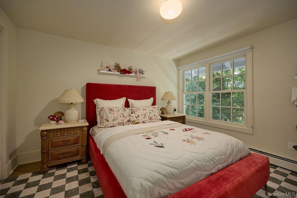 24 Acoma Road Tuxedo Park, NY 10987 - Photo 22 of 44 a bedroom with a bed and a window