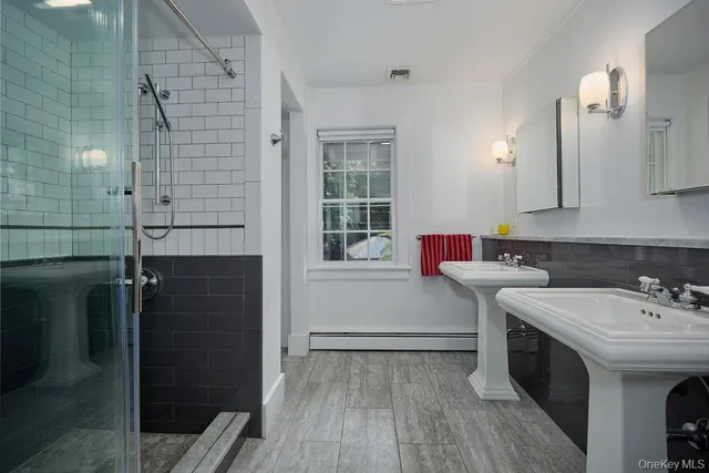 a bedroom with a bed and a flat tv screen