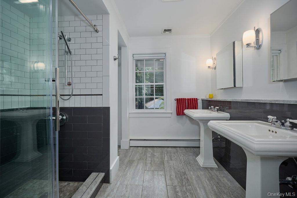 24 Acoma Road Tuxedo Park, NY 10987 - Photo 23 of 44 a bathroom with a sink and a mirror