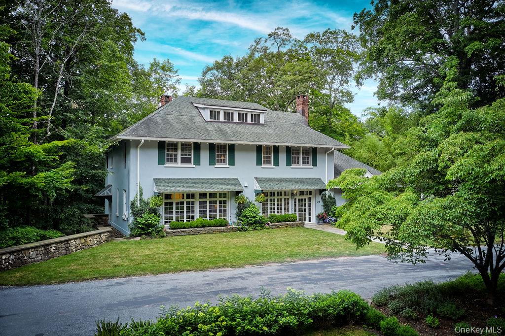 24 Acoma Road Tuxedo Park, NY 10987 - Photo 30 of 44 a front view of a house with a garden