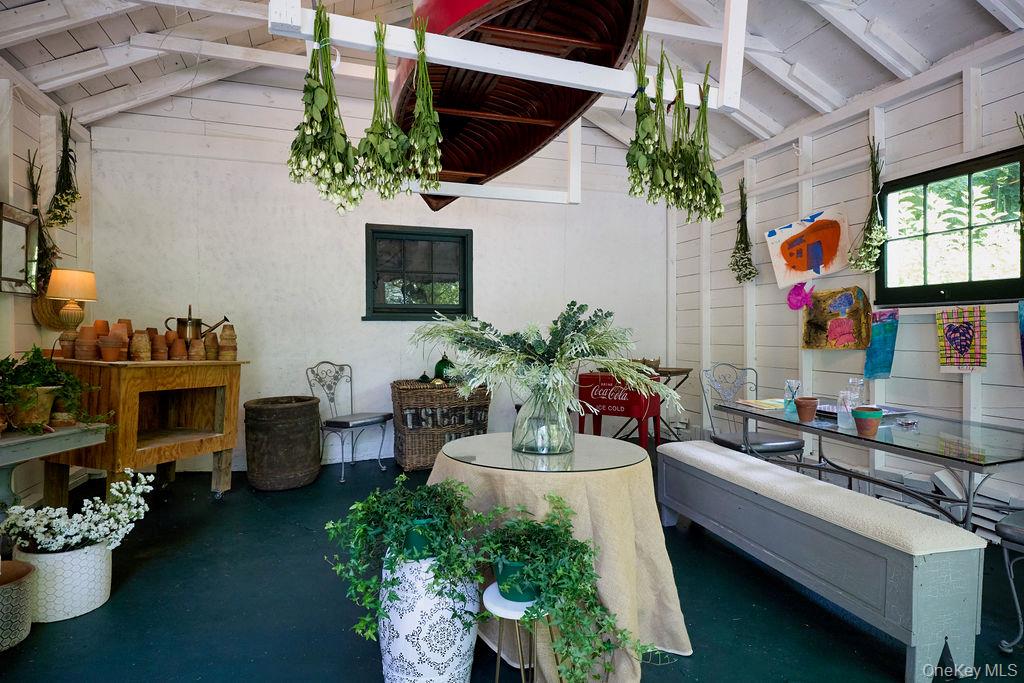 24 Acoma Road Tuxedo Park, NY 10987 - Photo 34 of 44 a living room filled with furniture and a potted plant