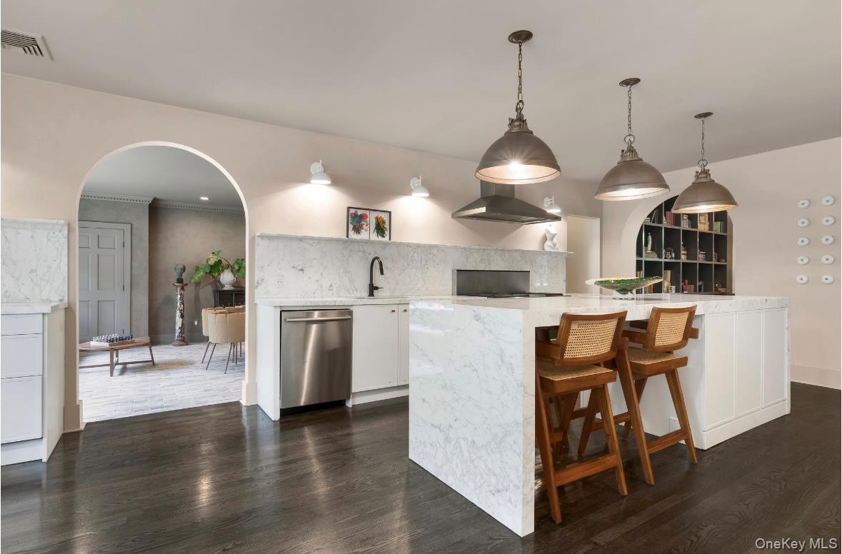 24 Acoma Road Tuxedo Park, NY 10987 - Photo 4 of 44 a view of a kitchen with furniture and wooden floor