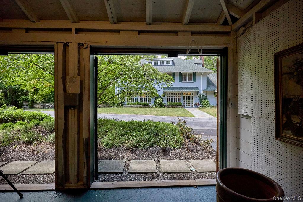 24 Acoma Road Tuxedo Park, NY 10987 - Photo 41 of 44 a view of a door of the house with a yard