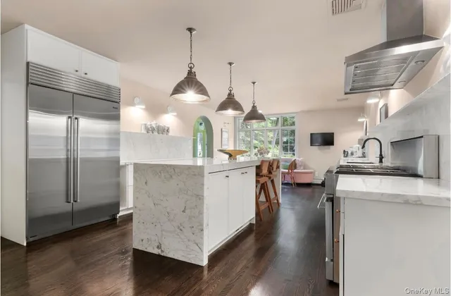 a kitchen with counter top space cabinets and stainless steel appliances