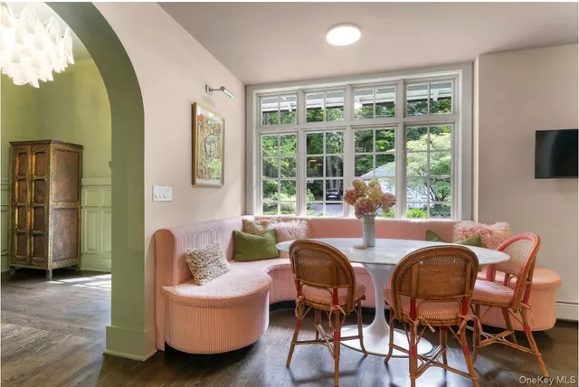 a dining room with furniture and window