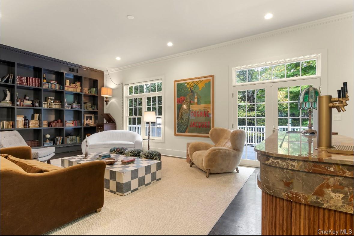 24 Acoma Road Tuxedo Park, NY 10987 - Photo 9 of 44 a living room with furniture and a large window