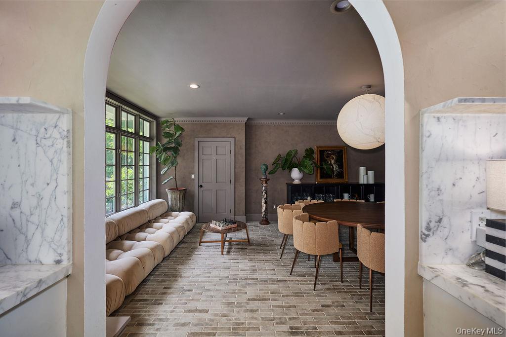 24 Acoma Road Tuxedo Park, NY 10987 - Photo 10 of 44 a living room with furniture and a large window