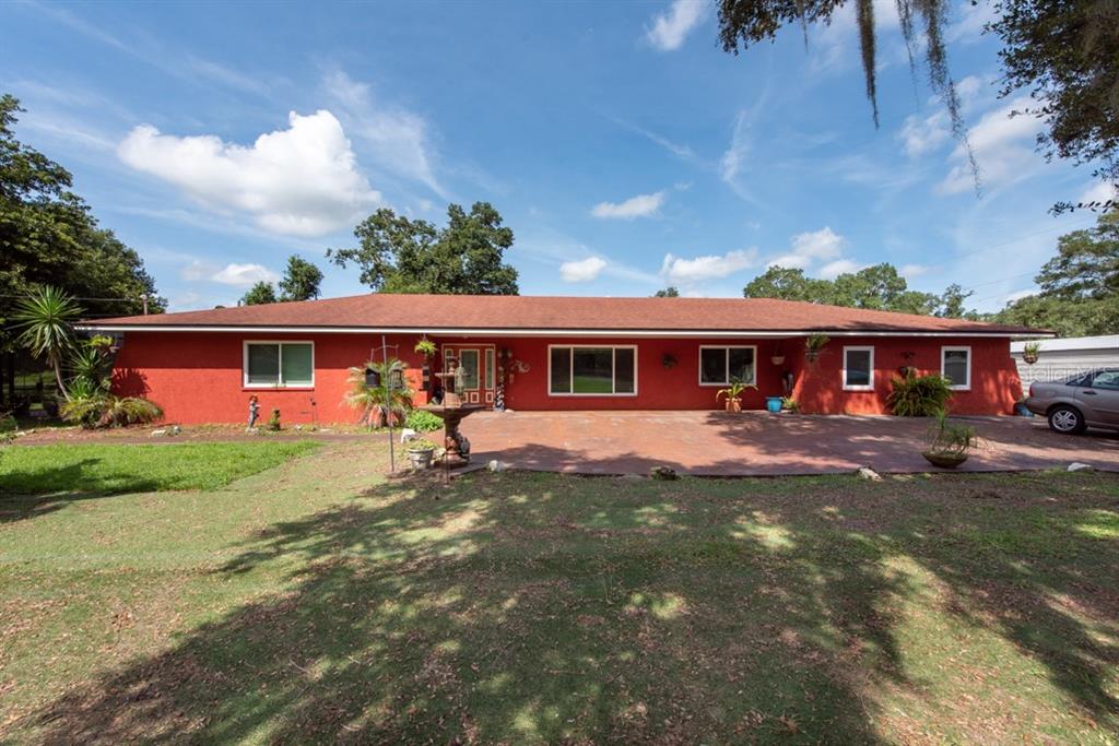 9822 Gallagher Road Dover, FL 33527 - Photo 1 of 1 front view of a house with a yard