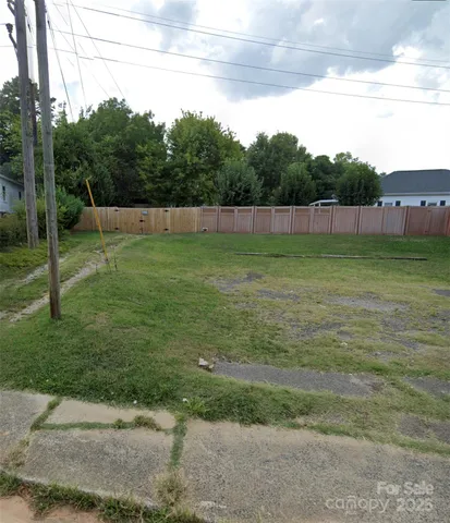 a view of a field with a big yard