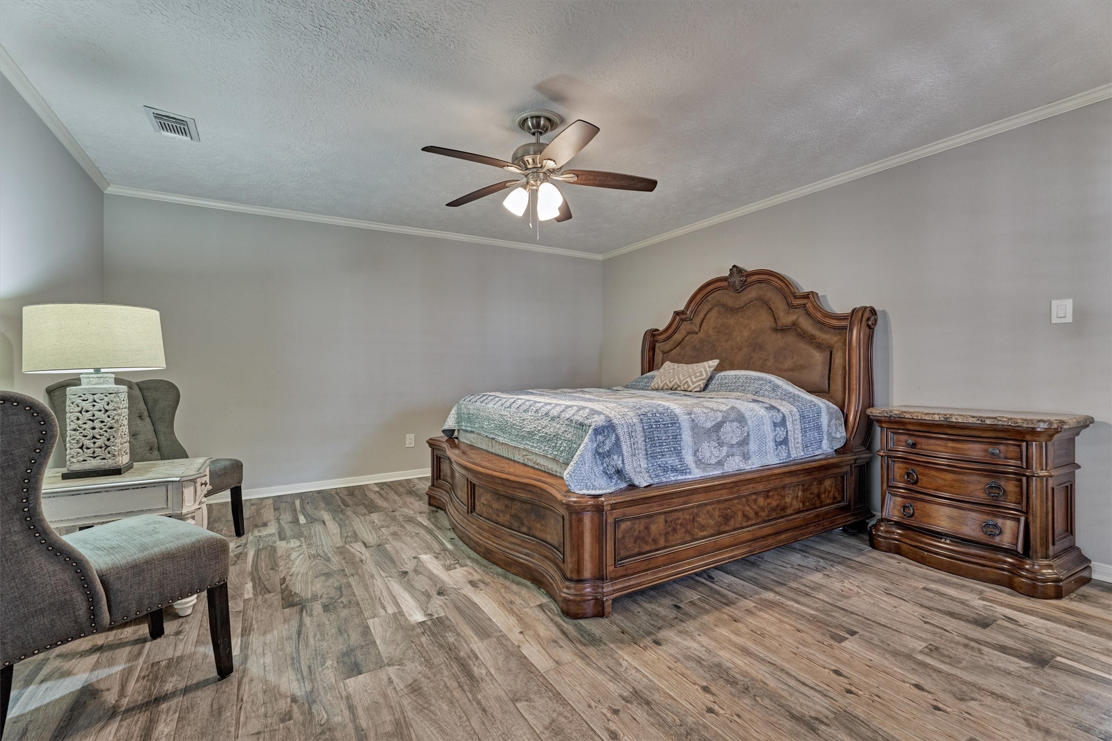 6522 Castle Pine Lane Spring, TX 77379 - Photo 12 of 49 a bedroom with a bed and wooden floor