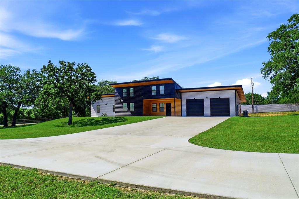 13240 Briar Road Azle, TX 76020 - Photo 3 of 39 a front view of a house with a yard