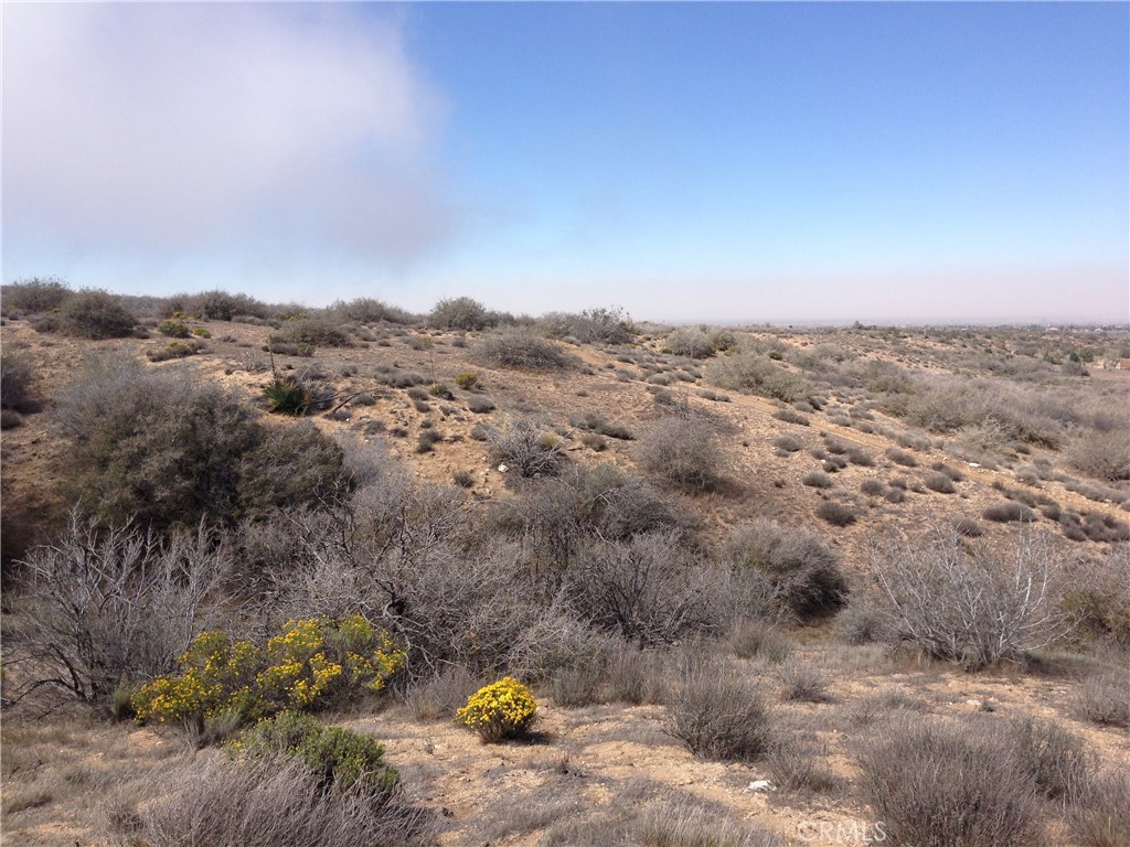 an aerial view of house with yard