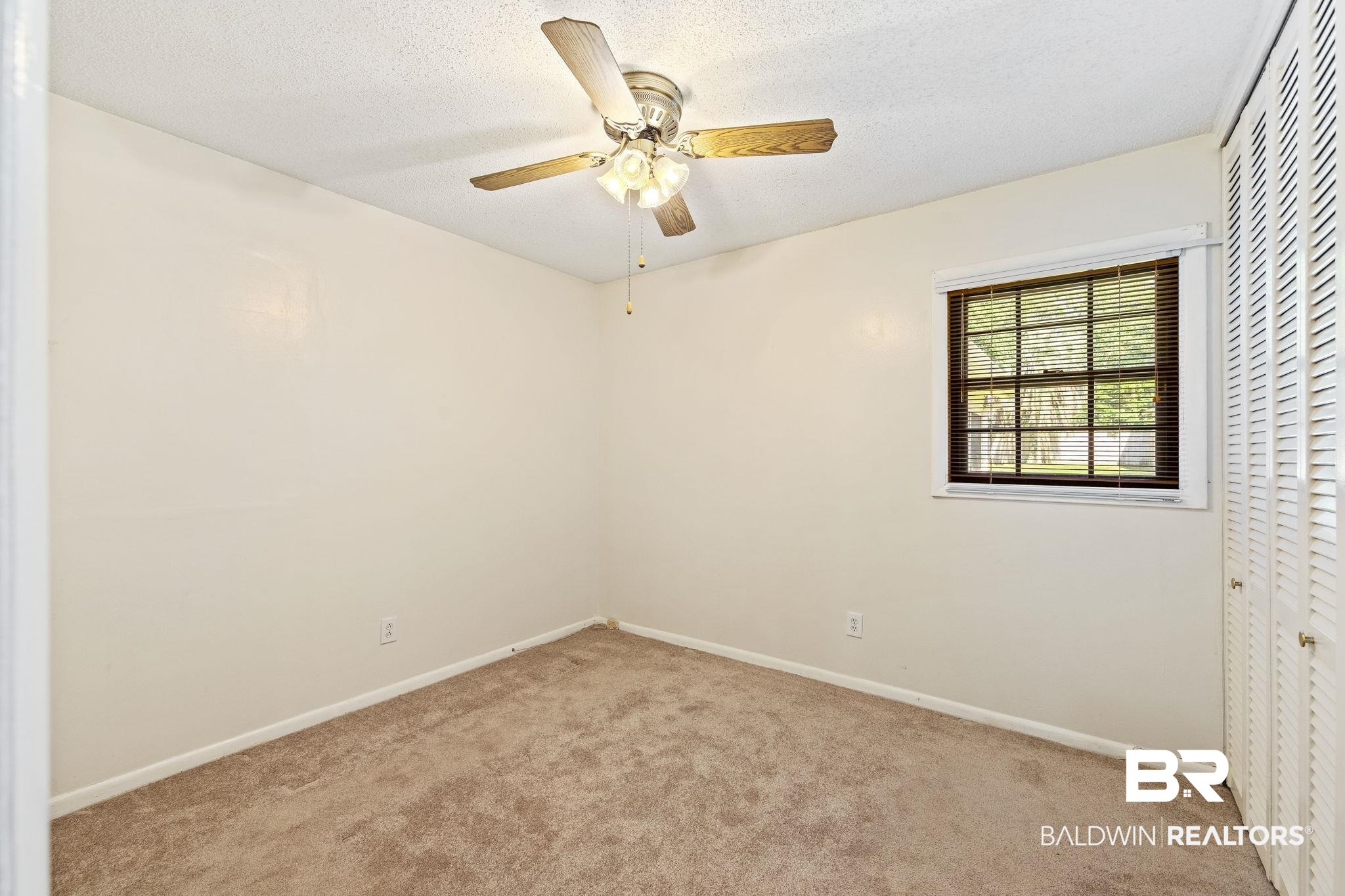 4366 Barden Avenue Mobile, AL 36619 - Photo 32 of 40 Unfurnished room with ceiling fan, a textured ceiling, and light carpet