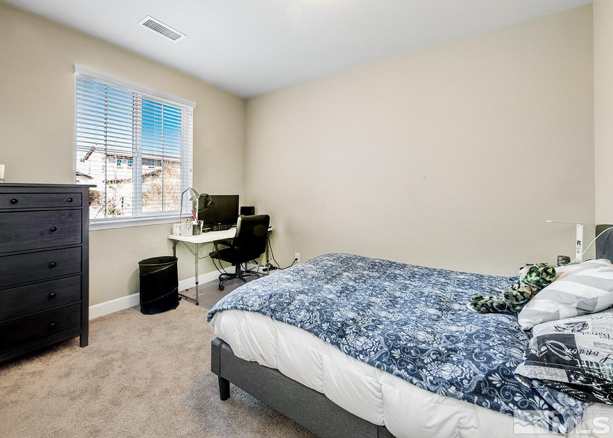 10250 Mott Drive Reno, NV 89521 - Photo 11 of 20 a bedroom with a bed and a window