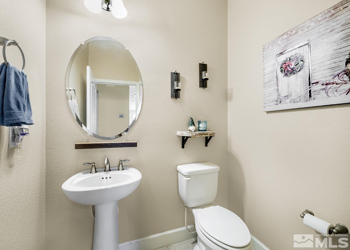 10250 Mott Drive Reno, NV 89521 - Photo 12 of 20 a bathroom with a toilet sink and mirror