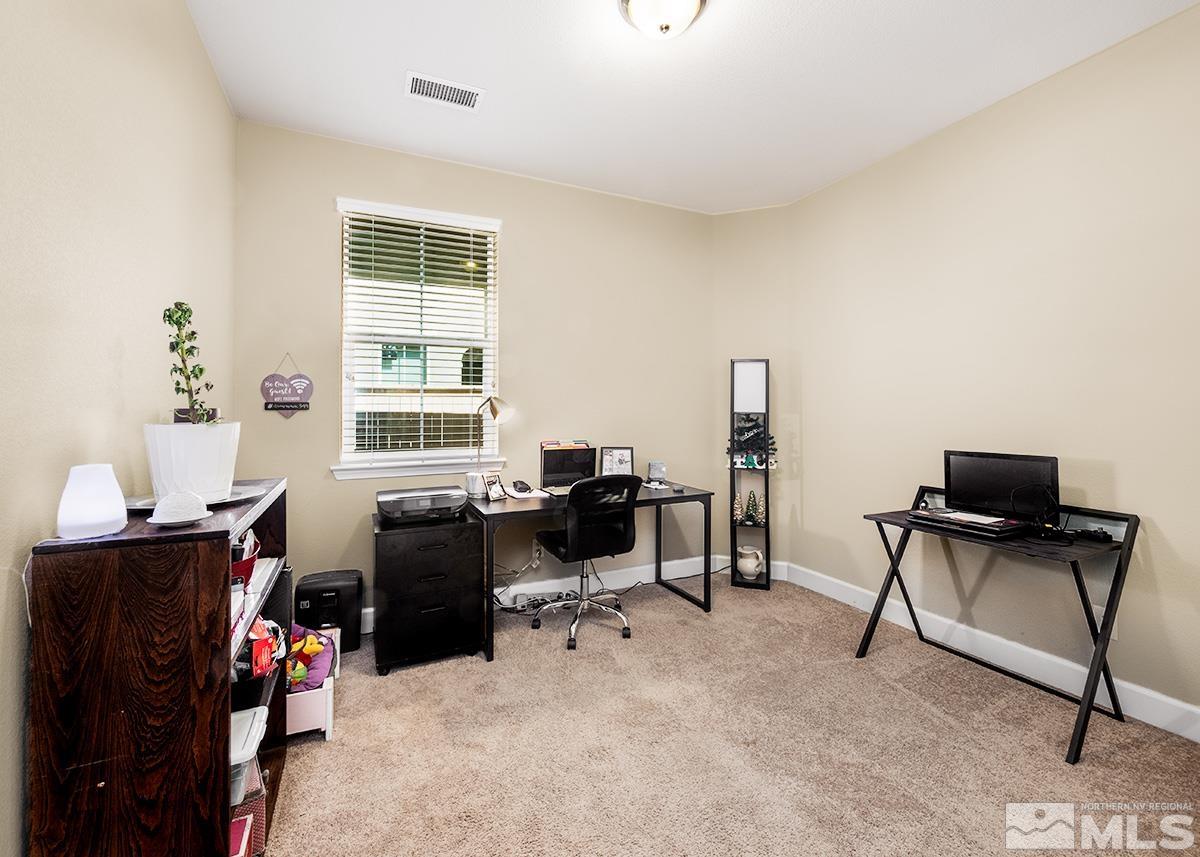 10250 Mott Drive Reno, NV 89521 - Photo 13 of 20 a view of a workspace with furniture and a window