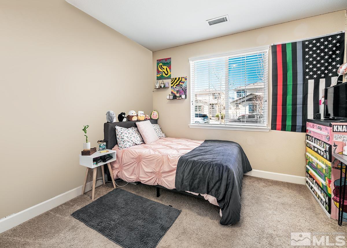 10250 Mott Drive Reno, NV 89521 - Photo 14 of 20 a bedroom with a bed and a window