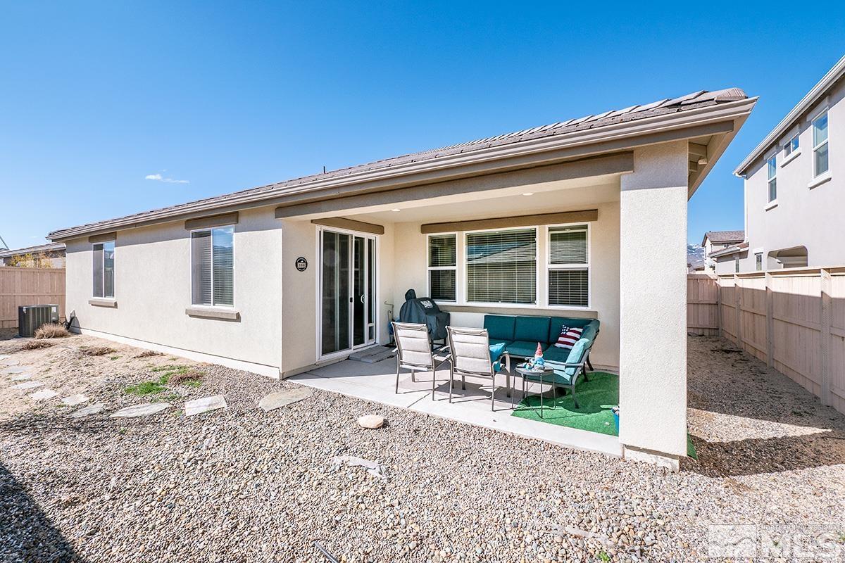 10250 Mott Drive Reno, NV 89521 - Photo 17 of 20 a front view of a house with sitting area