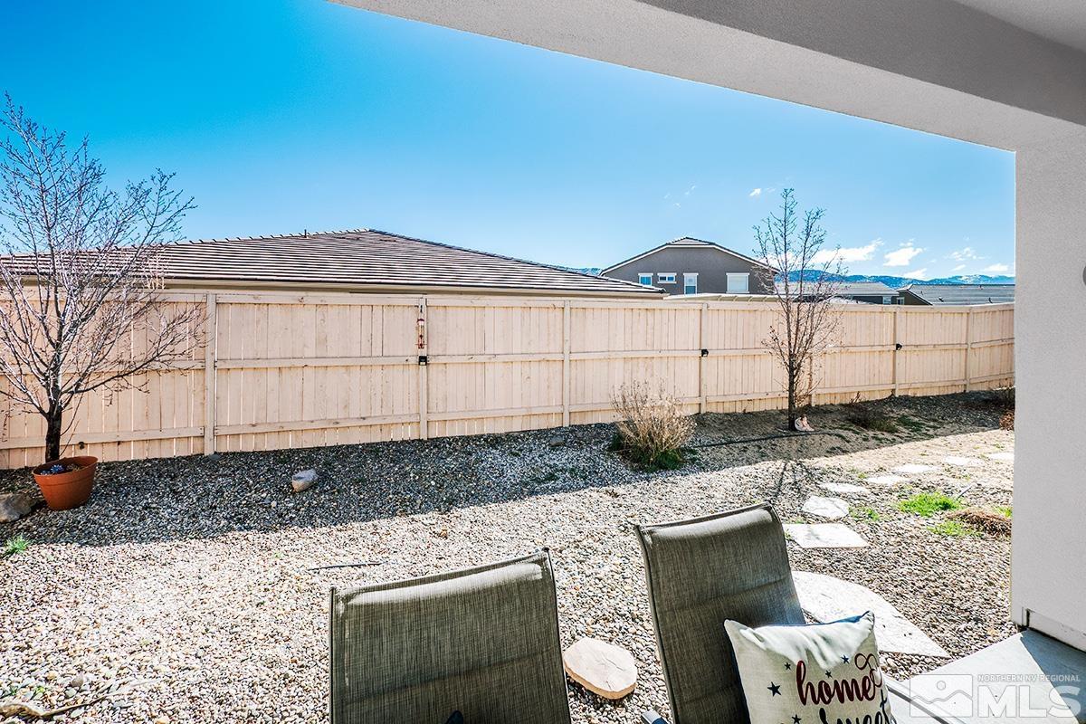 10250 Mott Drive Reno, NV 89521 - Photo 19 of 20 a view of a backyard with chair and tables