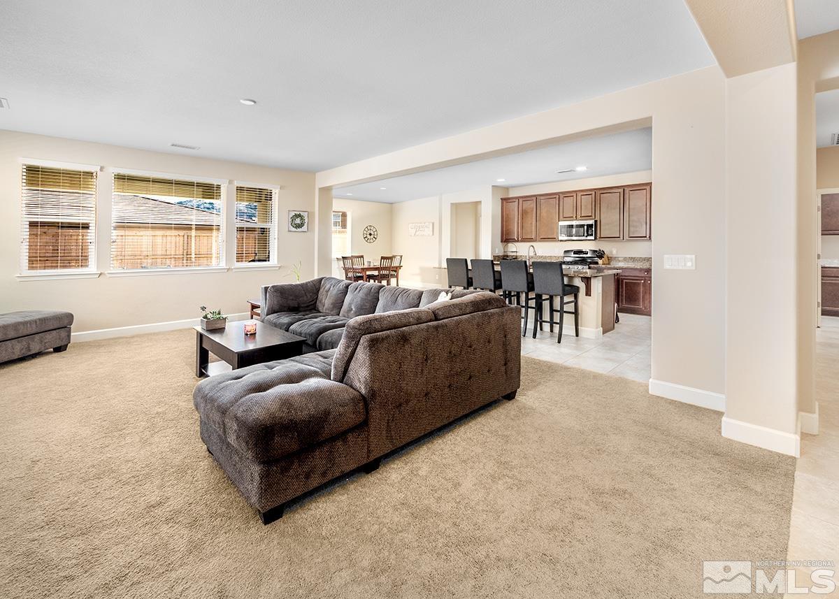 10250 Mott Drive Reno, NV 89521 - Photo 3 of 20 a living room with furniture and a flat screen tv