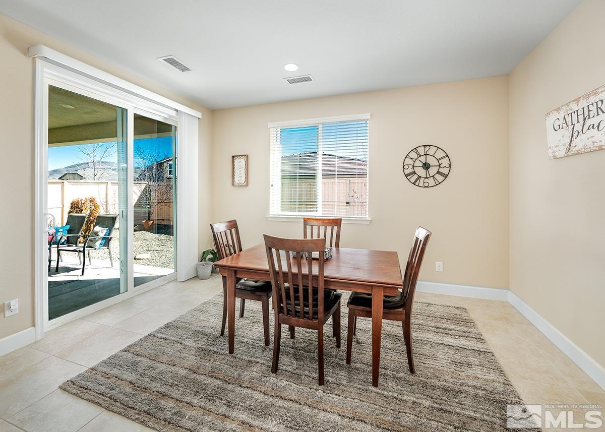 10250 Mott Drive Reno, NV 89521 - Photo 7 of 20 a view of a dining room with furniture wooden floor and a rug