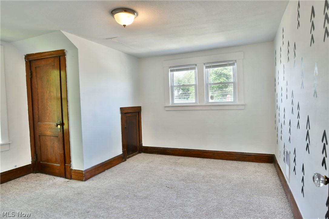 3617 South Main Street Mineral Ridge, OH 44440 - Photo 13 of 34 View of carpeted empty room