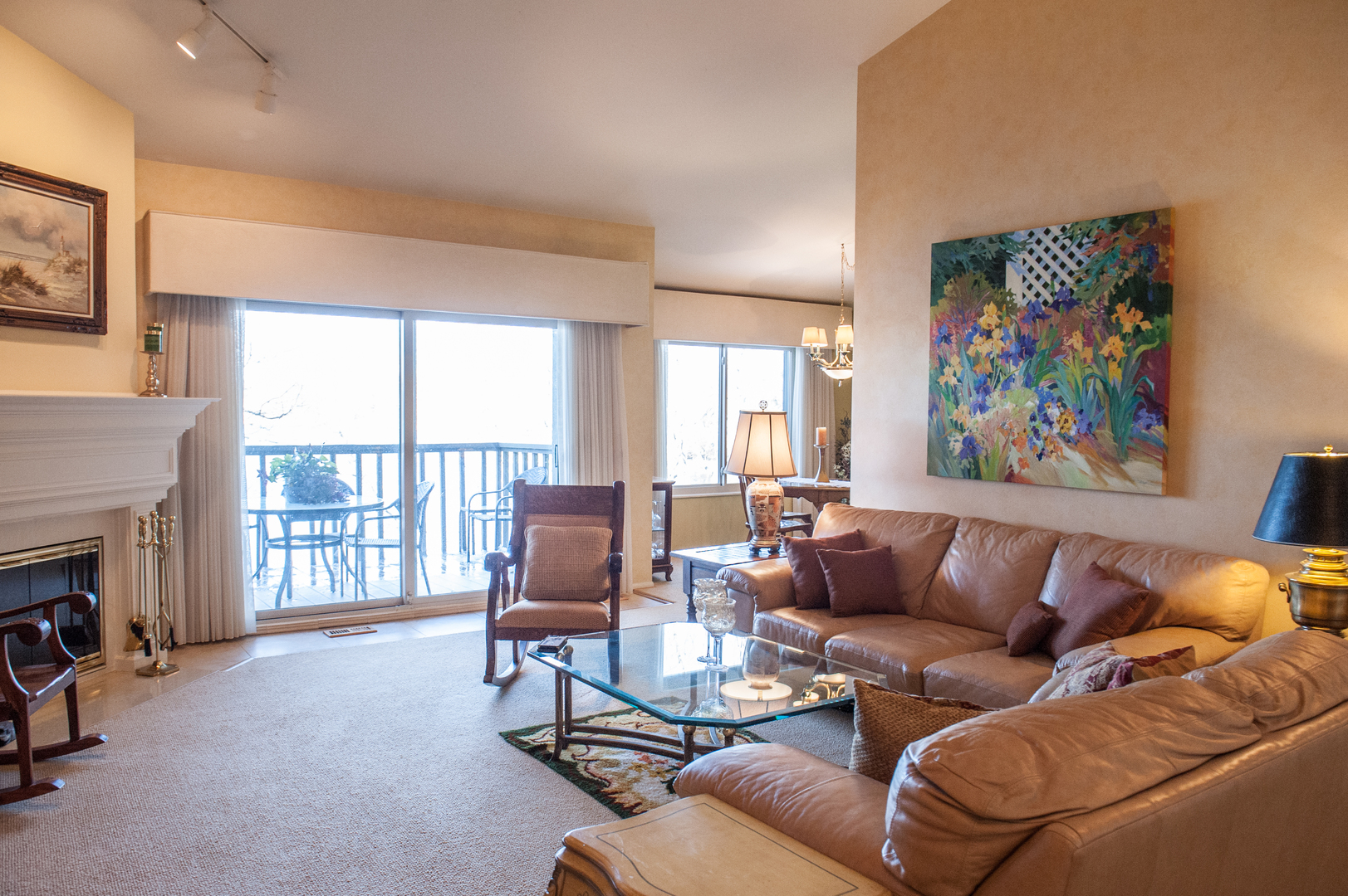 25 B Shoreline Road, Unit C345 Lake Barrington, IL 60010 - Photo 2 of 42 a living room with furniture a fireplace and a large window