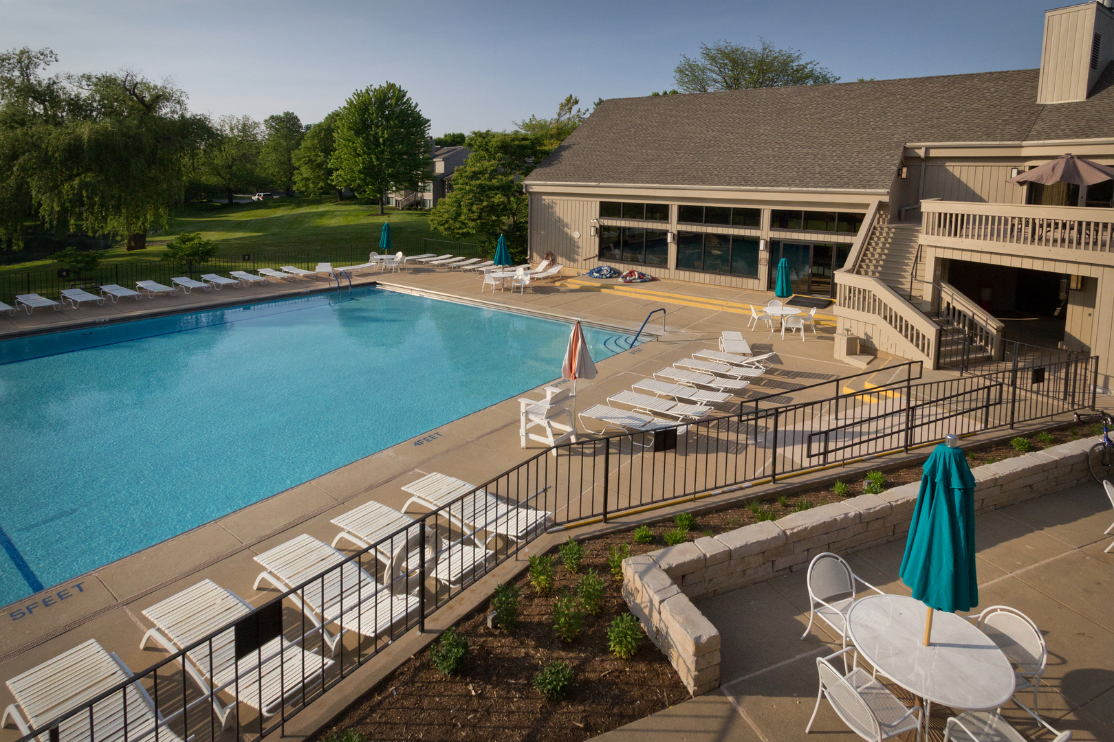 25 B Shoreline Road, Unit C345 Lake Barrington, IL 60010 - Photo 23 of 42 a view of a house with swimming pool and sitting area