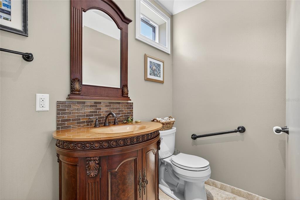 44 Colony Point Drive Punta Gorda, FL 33950 - Photo 30 of 84 a bathroom with a sink and a toilet