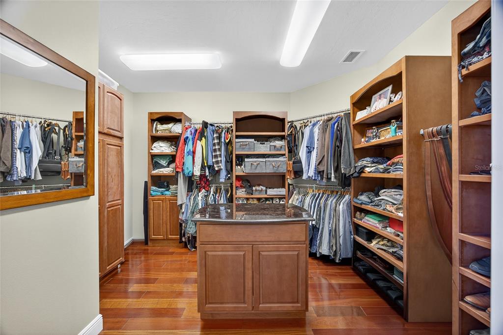44 Colony Point Drive Punta Gorda, FL 33950 - Photo 40 of 84 a view of walk in closet with clothes and shoes