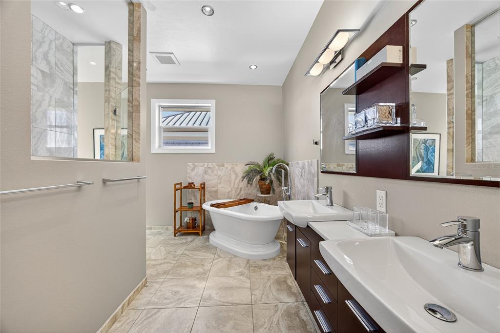 44 Colony Point Drive Punta Gorda, FL 33950 - Photo 41 of 84 a bathroom with a sink and a mirror