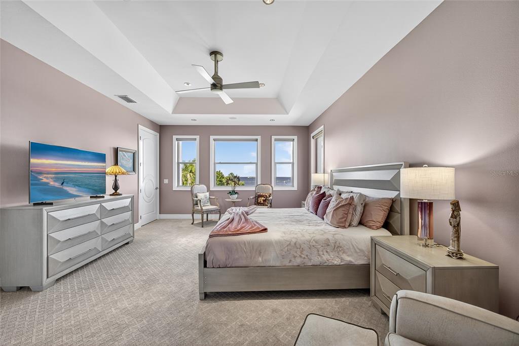 44 Colony Point Drive Punta Gorda, FL 33950 - Photo 46 of 84 a bedroom with furniture and a flat screen tv