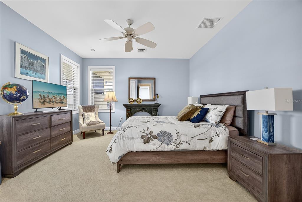 44 Colony Point Drive Punta Gorda, FL 33950 - Photo 49 of 84 a bedroom with a bed and wooden floor