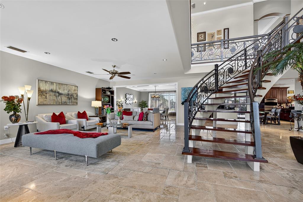 44 Colony Point Drive Punta Gorda, FL 33950 - Photo 7 of 84 a living room with furniture and a chandelier