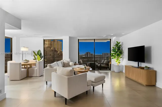 a living room with furniture and a flat screen tv