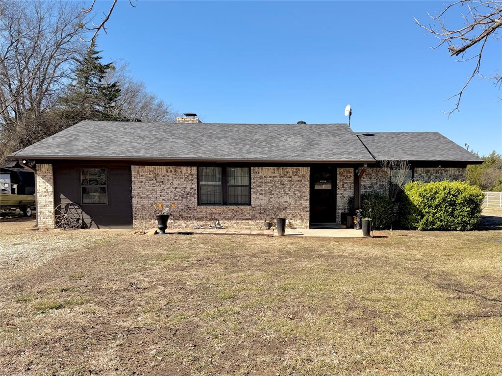 7615 Farm To Market 1499 Sumner, TX 75486 - Photo 1 of 18 a house with yard in front of it