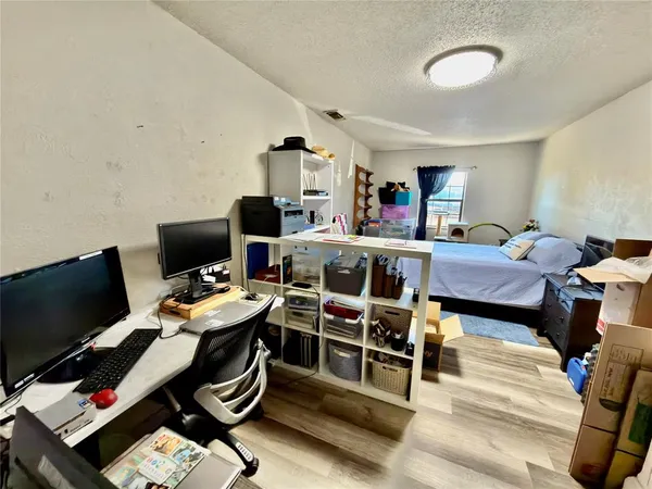 a view of a workspace with furniture