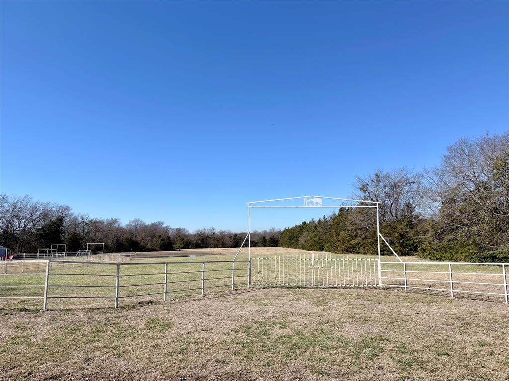 7615 Farm To Market 1499 Sumner, TX 75486 - Photo 18 of 18 a view of a field with large trees