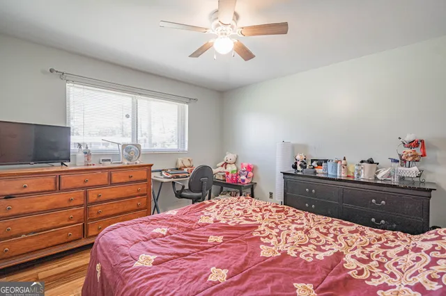 a bed room with a bed and a dresser