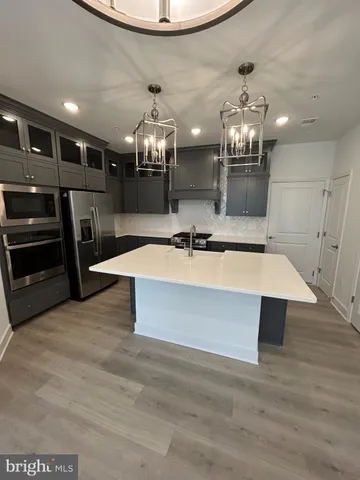 a view of lobby with furniture and chandelier